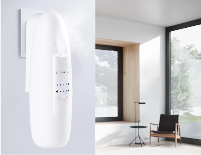 White cylindrical device on a light gray background with a room in the background